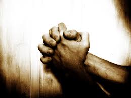 mans praying hands