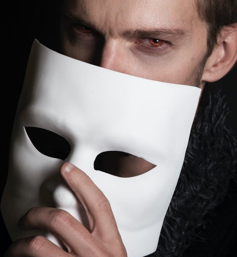 man with white face mask