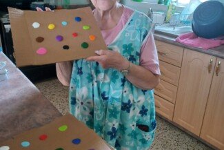 Miss Palma Getting Ready for Arts & Crafts.
